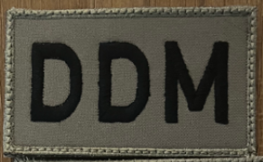 DDM (Velcro Patch) Black Letters / Tan Patch 2" x 3 1/2"